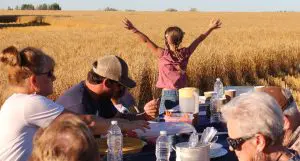 Meal with farm family in the field at harvest
